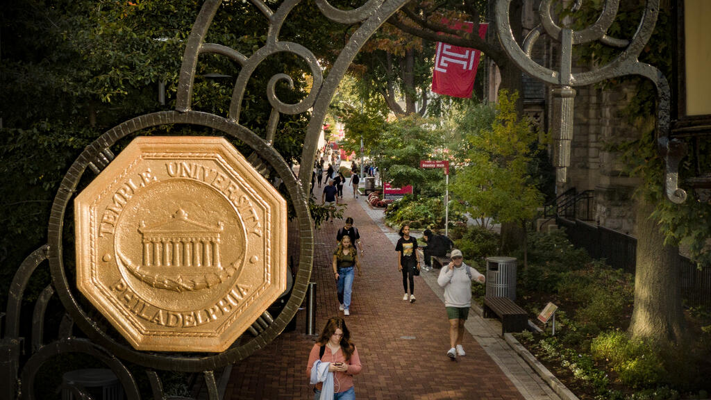 the gold university seal on the polett walk gates