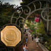 the gold university seal on the polett walk gates